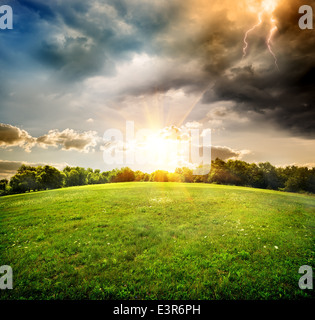 Bright lightning over the field and forest Stock Photo