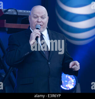 Hollywood, California, USA. 24th June, 2014. Jimmy Kimmel Live! Warm Up Comic Don Barris performs each day before JKL before the show's taping as well as in between set and break downs of skits, gags and musical performances. Known for his distinctive voice, Barris, a native of Chicago, has worked on Comedy Central as well as in movies and tv shows. In the photo, Barris is on stage before a musical performance at the JKL outside stage on Monday June 24, 2014. © David Bro/ZUMAPRESS.com/Alamy Live News Stock Photo