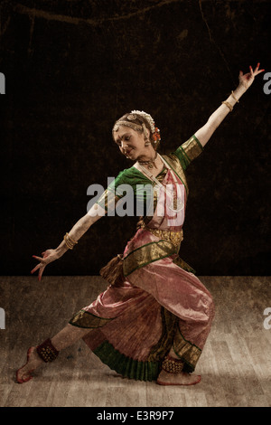 Vintage retro style image of young beautiful woman dancer exponent of Indian classical dance Bharatanatyam Stock Photo