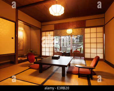 Traditional Japanese room interior at a ryokan with garden view in Kyoto, Japan. Stock Photo