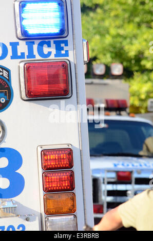 New York, USA. 27th June 2014.  Jun 27 2014 700 East 140 street, New York, USA//NYPD ESU trucks at the Male shot at 700 East 140 street. Police are searching for 3 male blacks, 1 wearing a red shirt and 2 wearing white shirts and blue jeans. Injured male treated and transported by EMS with unknown severity of injuries. Credit:  Michael Glenn/Alamy Live News Stock Photo