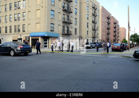 New York, USA. 27th June 2014.  Male shot at 700 East 140 street. Police are searching for 3 male blacks, 1 wearing a red shirt and 2 wearing white shirts and blue jeans. Injured male treated and transported by EMS with unknown severity of injuries. Credit:  Michael Glenn/Alamy Live News Stock Photo