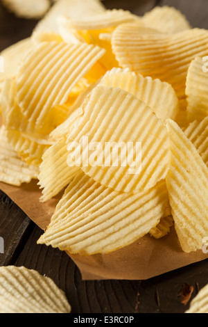 Unhealthy Crinkle Cut Potato Chips Ready to Eat Stock Photo