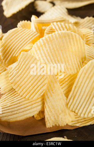 Unhealthy Crinkle Cut Potato Chips Ready to Eat Stock Photo