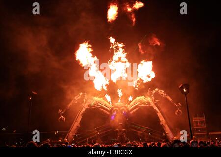 Glastonbury Festival. Glastonbury, Somerset, UK. 28th June, 2014. As crowds flock to Arcadia in the early hours of the morning the giant fire breathing mechanical spider comes to life. Arcadia is one of Glastonbury Festival's most popular all night venues attracting massive crowds from midnight to early morning. Credit:  Tom Corban/Alamy Live News Stock Photo