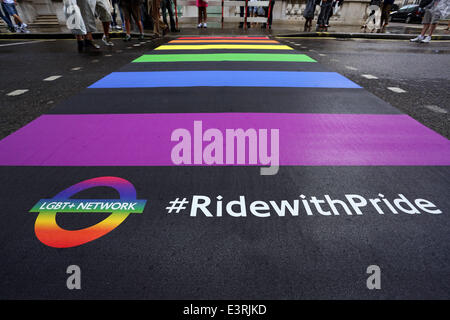London, UK. 28th June, 2014. London's first Rainbow Crossing unveiled at Pride London 2014 on Pall Mall East. The pedestrian crossing symbolises the colours of the Gay Pride flag and the LGBT community. Credit:  Paul Brown/Alamy Live News Stock Photo