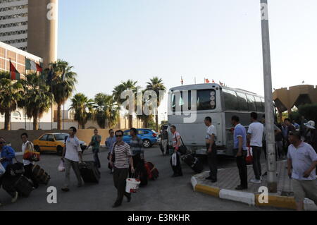 Baghdad, Iraq. 28th June, 2014. Chinese workers arrive in Baghdad, Iraq, on June 28, 2014. All of the more than 1,200 Chinese workers trapped in the northern Iraqi city of Samarra have been safely evacuated to the capital Baghdad, according to the Chinese embassy in Baghdad. © Shang Le/Xinhua/Alamy Live News Stock Photo