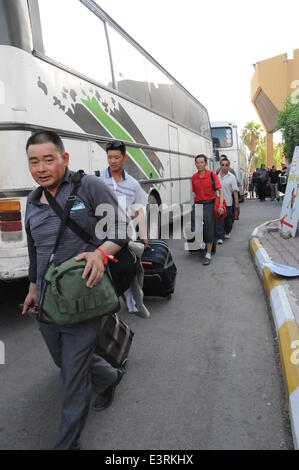 Baghdad, Iraq. 28th June, 2014. Chinese workers arrive in Baghdad, Iraq, on June 28, 2014. All of the more than 1,200 Chinese workers trapped in the northern Iraqi city of Samarra have been safely evacuated to the capital Baghdad, according to the Chinese embassy in Baghdad. © Shang Le/Xinhua/Alamy Live News Stock Photo