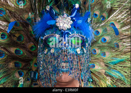 Baker Street, London, Uk. 28th June 2014. Participants in this year's London Gay Pride await eagerly for the event to begin. Pictured: A man in elaborate head dress waits for the Pride in London parade to begin. Credit:  Lee Thomas/Alamy Live News Stock Photo