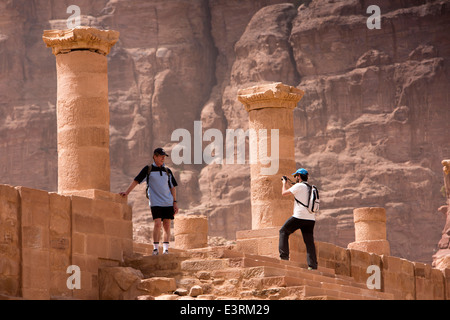 Jordan, Arabah, Petra, tourists taking souvenir picture on steps of Grand Temple of Winged Lions Stock Photo