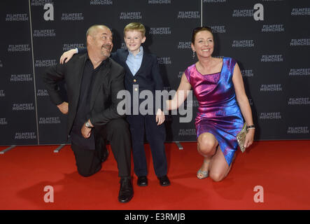 Munich, Germany. 27th June, 2014. The young Canadian actor Kyle Catlett (C), main character of the opening movie 'The Selected Works of T.S. Spivet', the manageress of the festival Diana Iljine and French director Jean-Pierre Jeunet pose during the opening of the Munich film festival in Munich, Germany, 27 June 2014. The festival runs from 27 June to 05 July 2014. Photo: Felix Hoerhager/dpa/Alamy Live News Stock Photo