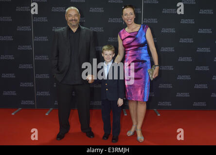 Munich, Germany. 27th June, 2014. The young Canadian actor Kyle Catlett (C), main character of the opening movie 'The Selected Works of T.S. Spivet', the manageress of the festival Diana Iljine and French director Jean-Pierre Jeunet pose during the opening of the Munich film festival in Munich, Germany, 27 June 2014. The festival runs from 27 June to 05 July 2014. Photo: Felix Hoerhager/dpa/Alamy Live News Stock Photo