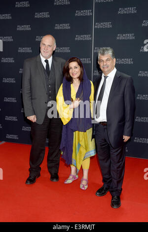 Munich, Germany. 27th June, 2014. The journalist Mark Adams, (L-R) the Iranian actress Fatemeh Mohammad Arya and Intishal Al Timimi pose during the opening of the Munich film festival in Munich, Germany, 27 June 2014. The festival runs from 27 June to 05 July 2014. Photo: Felix Hoerhager/dpa/Alamy Live News Stock Photo