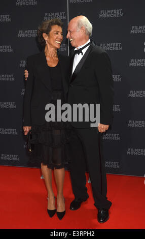 Munich, Germany. 27th June, 2014. Fasion designer and movie producer Willy Bogner and his wife Sonia pose during the opening of the Munich film festival in Munich, Germany, 27 June 2014. The festival runs from 27 June to 05 July 2014. Photo: Felix Hoerhager/dpa/Alamy Live News Stock Photo