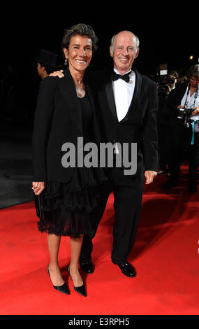 Munich, Germany. 27th June, 2014. Fasion designer and movie producer Willy Bogner and his wife Sonia pose during the opening of the Munich film festival in Munich, Germany, 27 June 2014. The festival runs from 27 June to 05 July 2014. Photo: Felix Hoerhager/dpa/Alamy Live News Stock Photo