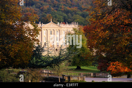 Chatsworth House stately home viewed from open access parkland, Peak District, England, UK - autumn Stock Photo