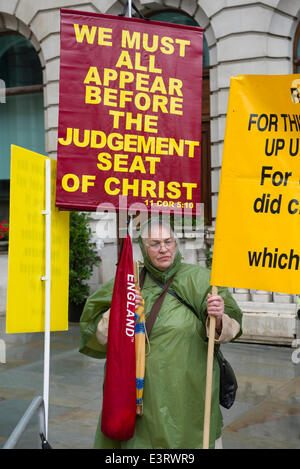 London, UK. 28th June, 2014. Marchers at the London Pride Parade confronted a motley band of Christian Protestors on Waterloo Place, London. 28 June 2014. Credit:  Steve Davey / Alamy Live News Stock Photo