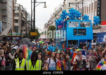 Baker Street, London, UK. 28th June, 2014.  crowds march down Oxford Street  in very wet and damp conditions for the start of Gay pride. Pride attracted thousands of visitors despite the heavy showers. Stock Photo