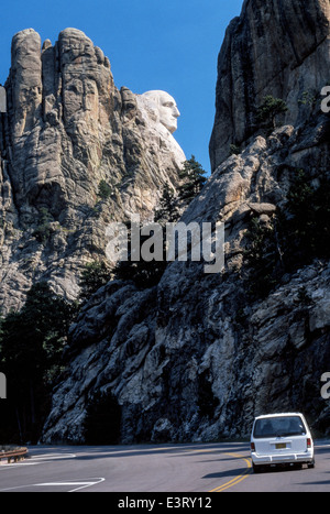 A highway in South Dakota, USA, surprises motorists with a profile of George Washington in the mountains at the Mount Rushmore National Memorial. Stock Photo