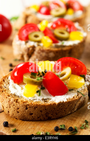 Fresh baked bruschetta sandwich with vegetables.Selective focus on the front bruschetta Stock Photo