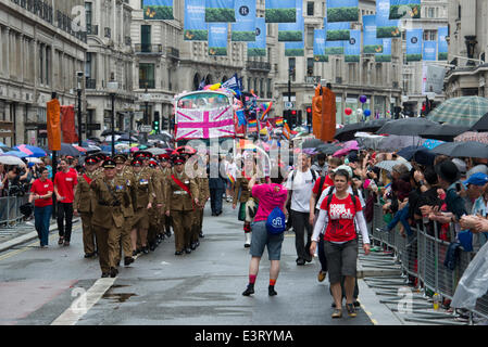 London, UK. 28th June 2014. Armed forces representatives join thousands of revellers who paraded through the streets of London to mark London Pride 2014. Credit:  Steve Davey/Alamy Live News Stock Photo