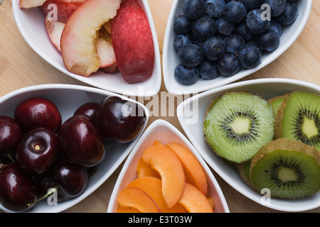 Healthy snacks including apricots, nectarines, cherries, blueberries and kiwi fruit. Stock Photo