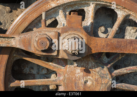 detail of driving rod mechanism on old steam locomotive in rust Stock Photo