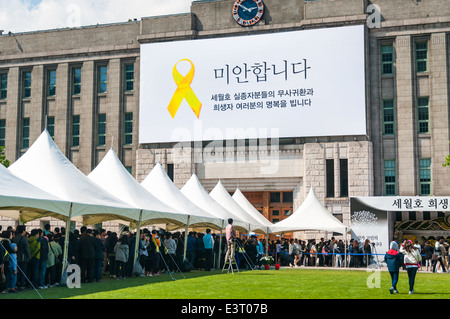 Mourners gather outside of Seoul City Hall on May 6, 2014 to pay their respects to victims of the Sewol ferry tragedy. Stock Photo