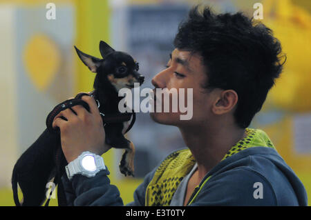 Manila, Philippine. 28th June, 2014. MANILA, Philippines - Hundreds of pet lovers join a Dog and Cat Expo held at a Convention Center in Pasay city, south of Manila on 28 June 2014. Now on its third year, the Pet Express Dog and Cat EXPO attracts thousands of dog and cat lovers of all ages as they hold this 2-day event, with various activities for the animals and their owners to participate in. The event aims to give the canine and feline community a venue to meet like-minded people and to learn more about animals and their welfare. Credit:  George Calvelo/NurPhoto/ZUMAPRESS.com/Alamy Live New Stock Photo