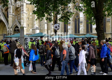 London, UK. 28th June 2014. Disabled People Against Cuts (DPAC) stage a protest outside Westminster Abbey to save the Independent Living Fund ILF. There is a very large Police response Credit:  Rachel Megawhat/Alamy Live News Stock Photo
