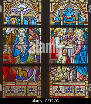 Bruges - The Adoration of Magi and the Wedding at Cana scene on the windwopane in st. Jacobs church (Jakobskerk). Stock Photo