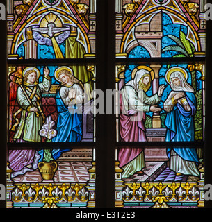 BRUGGE, BELGIUM - JUNE 12, 2014: The Annunciation and the Vistation to Elizabeth scene on the windwopane in st. Jacobs church Stock Photo