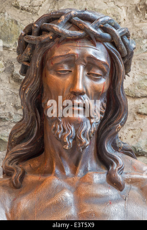 BRUGGE, BELGIUM - JUNE 13, 2014: Statue of Jesus in the bond in Basilica of the Holy bold. Stock Photo