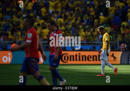 Belo Horizonte, Brazil. 28th June, 2014. Brazil's Neymar leaves the field after the regular time of a Round of 16 match between Brazil and Chile of 2014 FIFA World Cup at the Estadio Mineirao Stadium in Belo Horizonte, Brazil, on June 28, 2014. Credit:  Liu Dawei/Xinhua/Alamy Live News Stock Photo