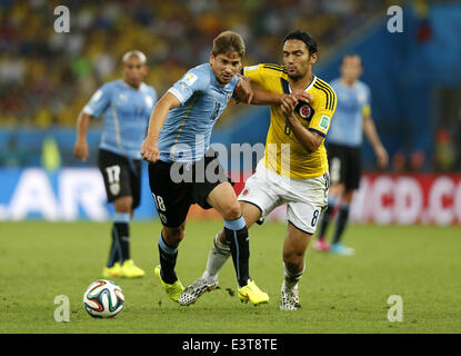 Rio De Janeiro, Brazil. 28th June, 2014. Uruguay's Gaston Ramirez (L, front) vies with Colombia's Abel Aguilar during a Round of 16 match between Colombia and Uruguay of 2014 FIFA World Cup at the Estadio do Maracana Stadium in Rio de Janeiro, Brazil, on June 28, 2014. Credit:  Wang Lili/Xinhua/Alamy Live News Stock Photo