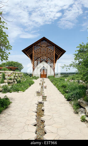 Gretna, NEBRASKA, USA. 3rd June, 2014. The Holy Family Shrine, 23132 Pflug Road, Gretna, NE was opened in 2002. Designed by BCDM Architects of Omaha, Nebraska. The unique church in the bluffs over looking the Platte Valley is visible from both directions on Interstate 80. The shrine is glass-walled, with supports holding up its 45-ft. tall roof. A man-made stream bubbles along a path cut along the walkway to the entrance and then in the floor of the nave. © Kevin E. Schmidt/ZUMAPRESS.com/Alamy Live News Stock Photo