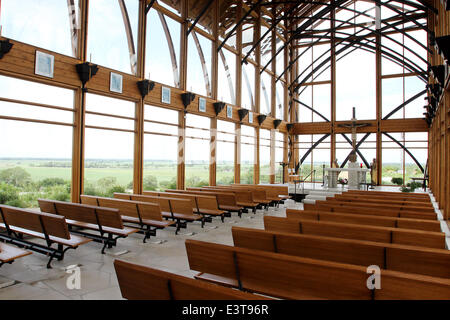 Gretna, NEBRASKA, USA. 3rd June, 2014. Looking West from the rear of the Holy Family Shrine, 23132 Pflug Road, Gretna, NE was opened in 2002. Designed by BCDM Architects of Omaha, Nebraska. The unique church in the bluffs over looking the Platte Valley is visible from both directions on Interstate 80. The shrine is glass-walled, with supports holding up its 45-ft. tall roof. A man-made stream bubbles along a path cut along the walkway to the entrance and then in the floor of the nave. © Kevin E. Schmidt/ZUMAPRESS.com/Alamy Live News Stock Photo