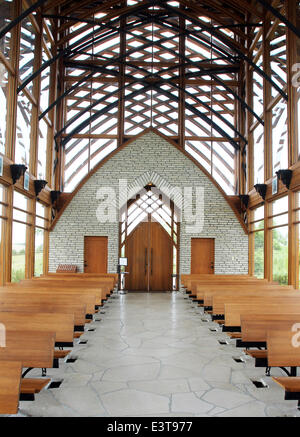 Gretna, NEBRASKA, USA. 3rd June, 2014. The Holy Family Shrine, 23132 Pflug Road, Gretna, NE was opened in 2002. Designed by BCDM Architects of Omaha, Nebraska. The unique church in the bluffs over looking the Platte Valley is visible from both directions on Interstate 80. The shrine is glass-walled, with supports holding up its 45-ft. tall roof. A man-made stream bubbles along a path cut along the walkway to the entrance and then in the floor of the nave. © Kevin E. Schmidt/ZUMAPRESS.com/Alamy Live News Stock Photo