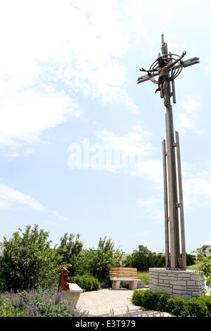 Gretna, NEBRASKA, USA. 3rd June, 2014. The Cross at The Holy Family Shrine near Gretna, NE is made of stainless steel tubing, is approximately 40 feet tall (one foot for each day of Lent), and weighs 2,820 pounds. The figure of Christ is just over 8 feet tall, made of cast bronze, weighing in at 528 pounds. © Kevin E. Schmidt/ZUMAPRESS.com/Alamy Live News Stock Photo