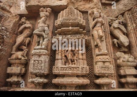 Odisha, India. 28th June, 2014. Carvings are seen at the Sun Temple in Konarak of Odisha, India, June 28, 2014. On the shores of the Bay of Bengal, bathed in the rays of the rising sun, the temple at Konarak is a monumental representation of the sun god Surya's chariot. Its 24 wheels are decorated with symbolic designs and it is led by a team of six horses. Built in the 13th century, it is one of India's most famous Brahman sanctuaries. The Konarak Sun Temple was enlisted by the UNESCO as a world heritage in 1984. © Zheng Huansong/Xinhua/Alamy Live News Stock Photo