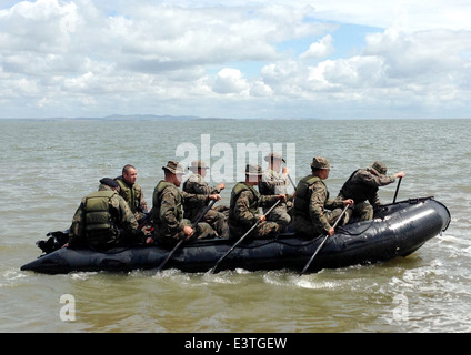 US Marines and Romanian sailors conduct beach reconnaissance during joint training exercises June 18, 2014 in Romania. Stock Photo