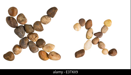 English Alphabet Letter 'X' made by small rocks on isolate background. Stock Photo