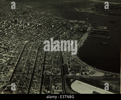 This aerial photograph shows the Consolidated/Convair aircraft factory in San Diego, a major site for military and civilian aircraft production. The factory played a key role in the development of WWII bombers and post-war aircraft. Stock Photo