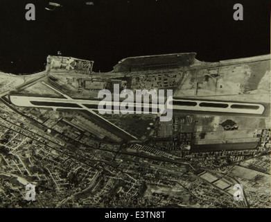 This aerial photograph shows the Consolidated/Convair aircraft factory at Lindbergh Field, San Diego. The plant, key to the development of military and commercial aircraft, played a crucial role in the production of iconic aircraft like the B-24 Liberator and B-32 Dominator during World War II. Stock Photo
