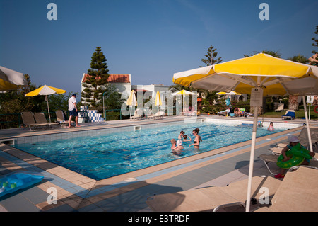 People On Holiday Enjoying The Sun In and Around The Hotel Swimming Pool Iberostar Creta Marine Panormo Crete Stock Photo