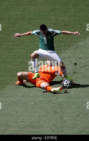 Fortaleza, Brazil. 29th June, 2014. Mexico's Hector Herrera (up) vies with Netherlands' Ron Vlaar during a Round of 16 match between Netherlands and Mexico of 2014 FIFA World Cup at the Estadio Castelao Stadium in Fortaleza, Brazil, on June 29, 2014. Credit:  Liao Yujie/Xinhua/Alamy Live News Stock Photo
