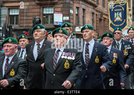 Glasgow, UK. 29th June, 2014. More than 1200 service personnel, including past, retired and veterans took part in Glasgow's annual parade and celebration of Armed Forces Day through the city centre and finally assembled in George Square. The parade was led by the band of the Royal Marines and was cheered by many well wishers along the route. Credit:  Findlay/Alamy Live News