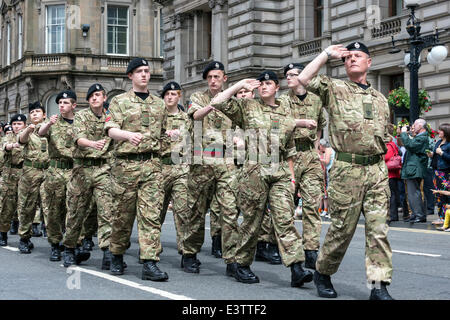 Glasgow, UK. 29th June, 2014. More than 1200 service personnel, including past, retired and veterans took part in Glasgow's annual parade and celebration of Armed Forces Day through the city centre and finally assembled in George Square. The parade was led by the band of the Royal Marines and was cheered by many wellwishers along the route. Credit:  Findlay/Alamy Live News