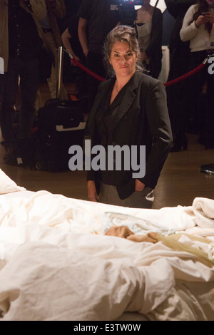 Tracey Emin poses with her famous artwork 'My Bed' (1998) at Christie's, London, prior to an auction. Stock Photo