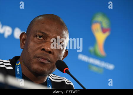 Brasilia, Brazil. 29th June, 2014. Nigeria's national soccer team coach Stephen Keshi listens during a press conference at the 'Mane Garrincha' National Stadium  in Brasilia, Brazil, 29 June 2014. Nigeria will face France in the FIFA World Cup 2014 round of 16 match in Brasilia on 30 June 2014. Credit:  dpa picture alliance/Alamy Live News
